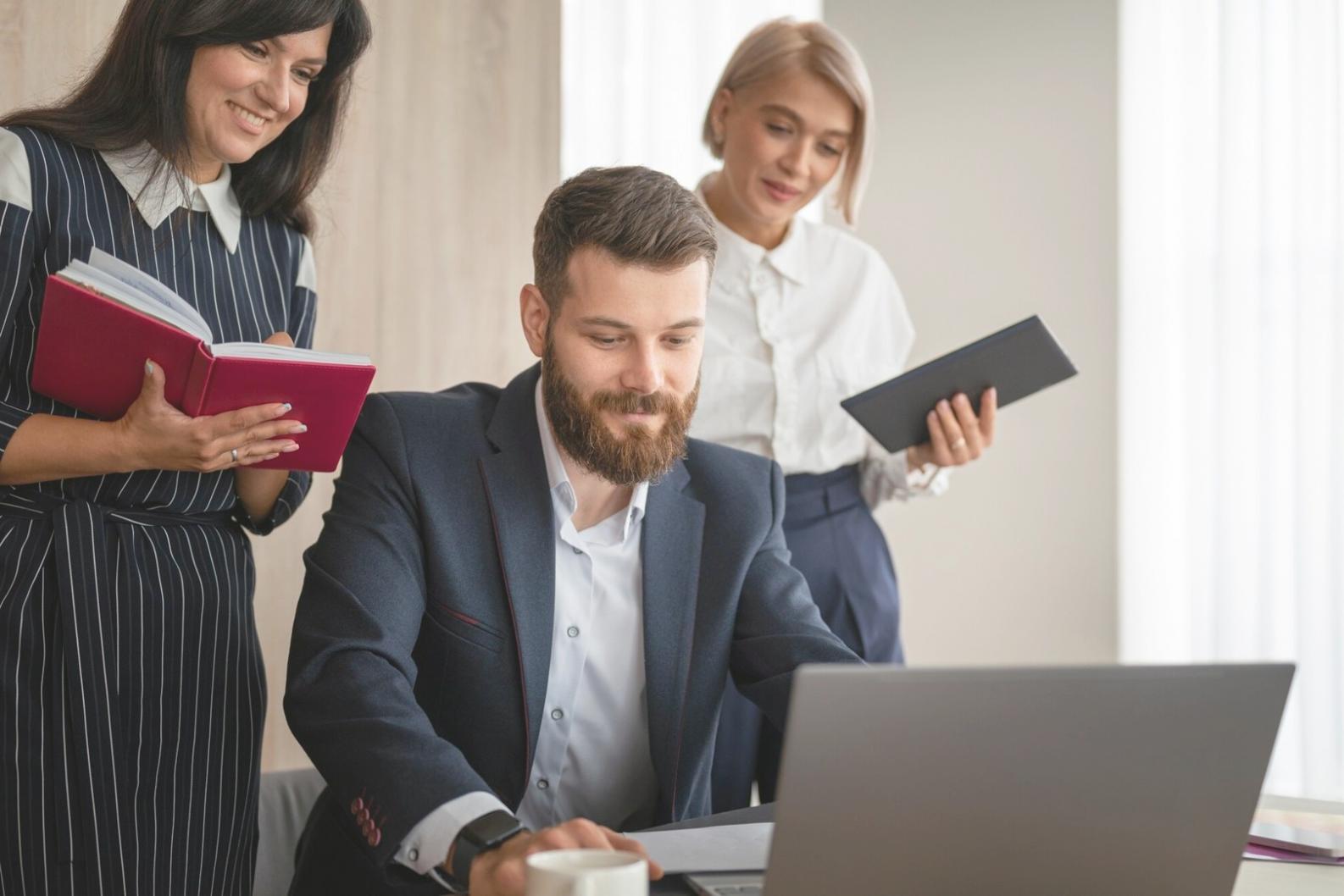 Students reviewing budget variance reports during course session