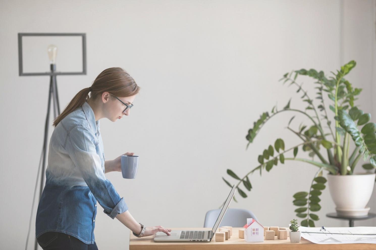 Student working on variance analysis at computer workstation